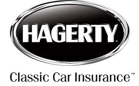 Logo of a company called "Hagerty" its white font on a black background with a encasing metallic ring with the words under "Classic Car Insurance" - first priority insurance