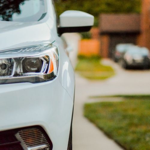 Picture of a closeup headlight of a car - first priority insurance